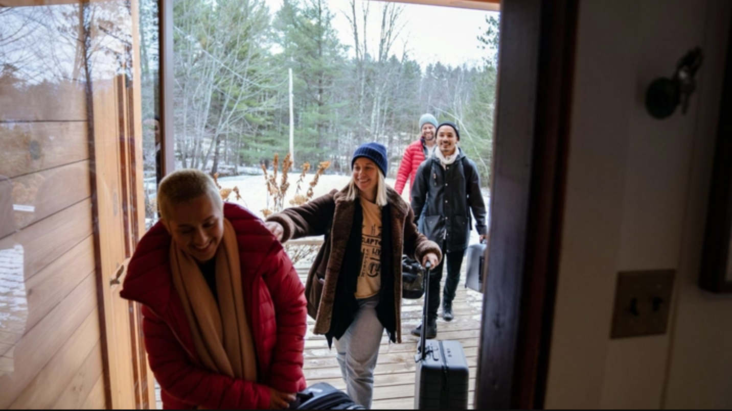 A group of people that will be sharing a house moving in