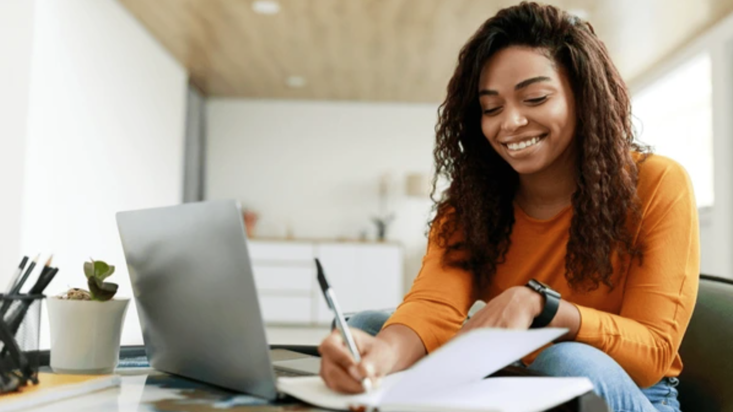 A woman determining what factors are affecting real estate market prices.