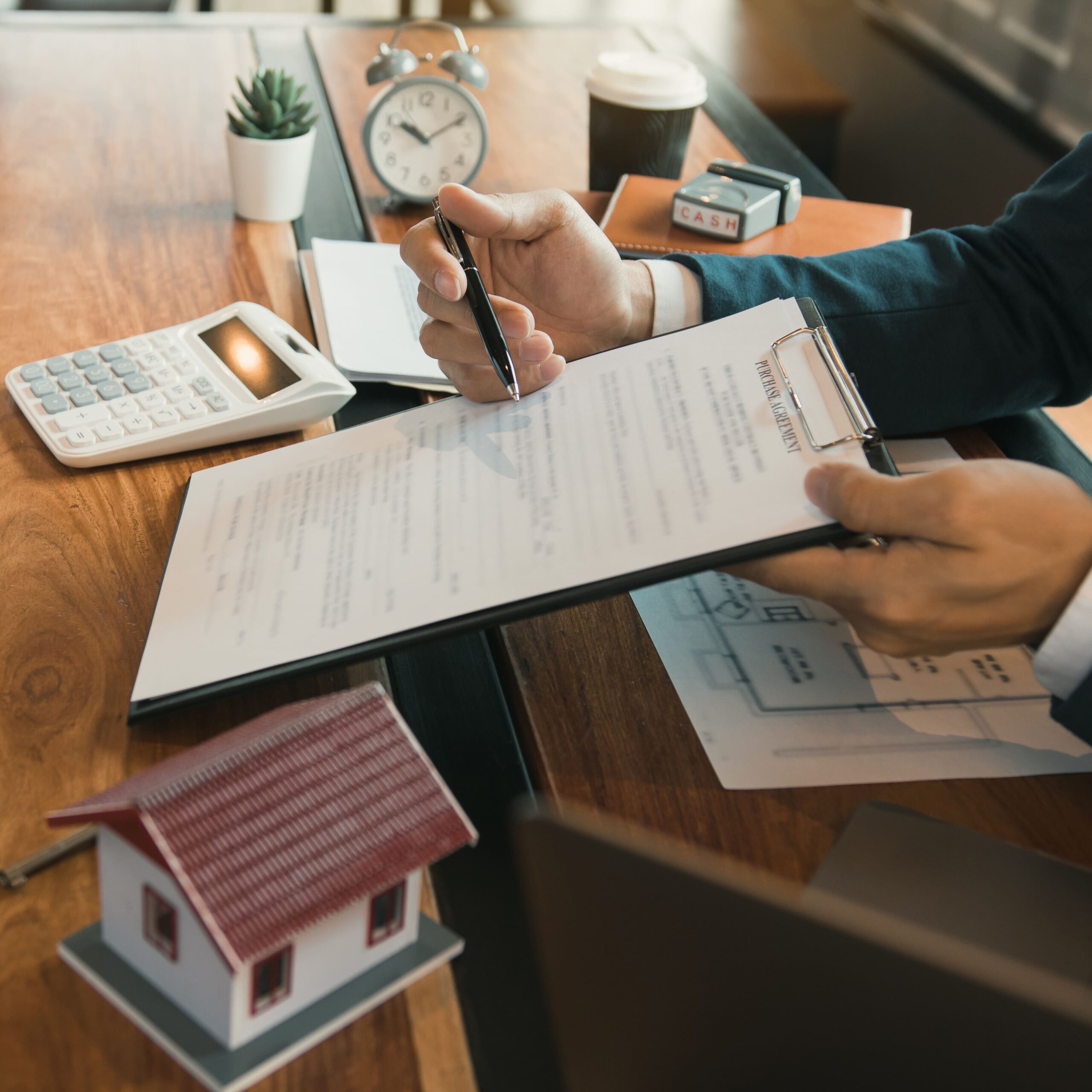A loan officer reviews a property’s financials during a loan application, ensuring DSCR requirements are met for financing approval.